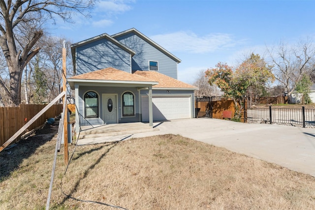 view of property with a garage, a front yard, and covered porch