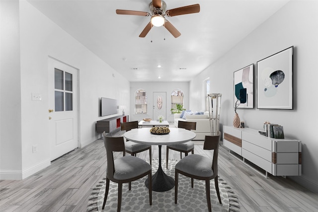 dining room featuring ceiling fan and light hardwood / wood-style flooring