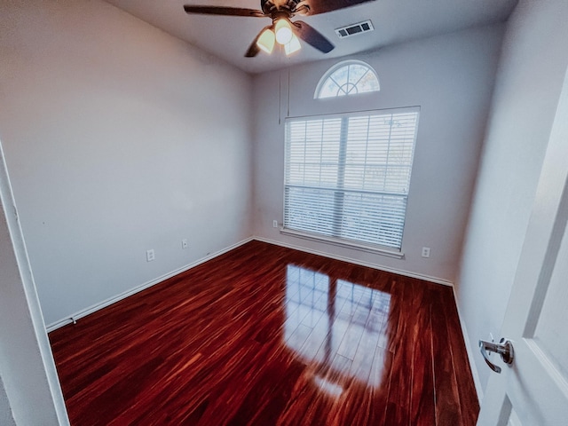 unfurnished room with ceiling fan and wood-type flooring