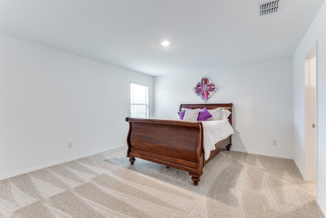 bedroom featuring light colored carpet