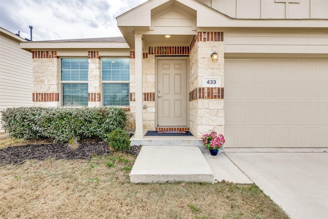 doorway to property featuring a garage