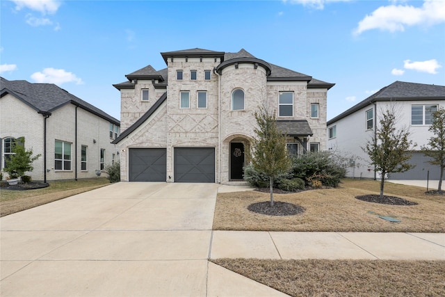 french country inspired facade featuring a garage