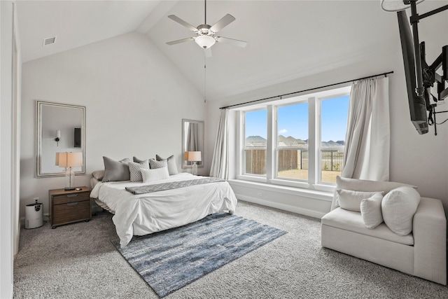 carpeted bedroom featuring ceiling fan and high vaulted ceiling