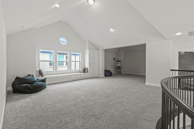 interior space featuring lofted ceiling and carpet floors