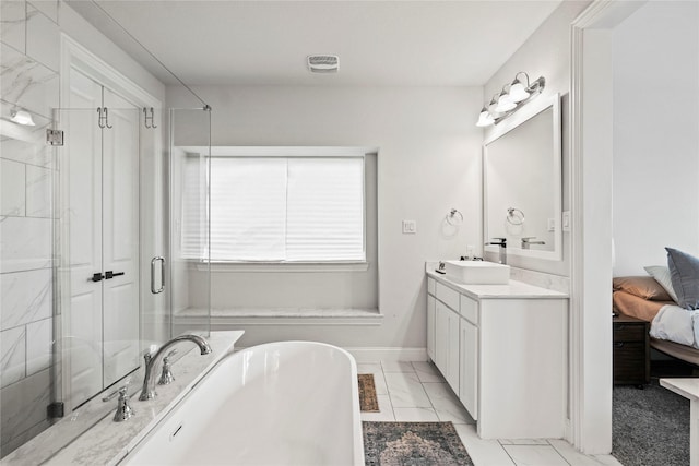 bathroom with vanity and shower with separate bathtub