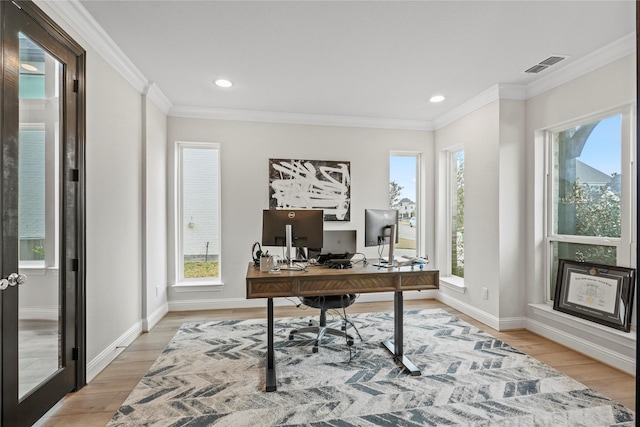 office with hardwood / wood-style floors and ornamental molding