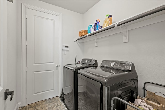 laundry area with separate washer and dryer