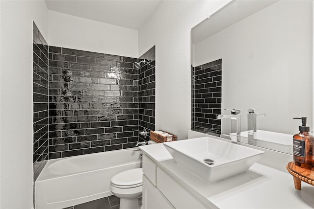 full bathroom with toilet, tiled shower / bath combo, tile patterned flooring, and vanity