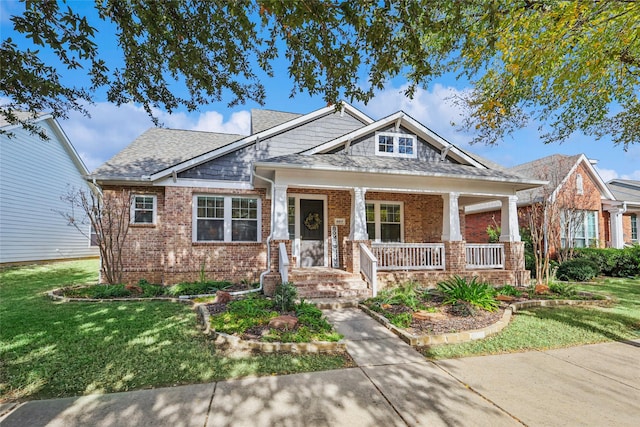 craftsman-style home featuring a front yard and a porch