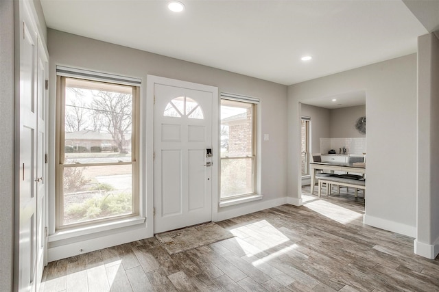 entryway with hardwood / wood-style flooring