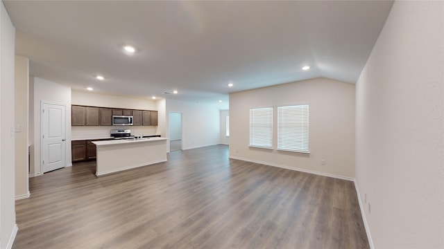 unfurnished living room with lofted ceiling and hardwood / wood-style floors