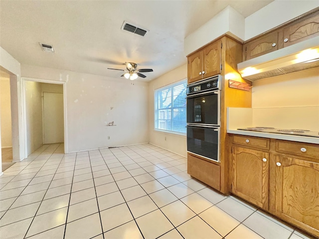 kitchen with ceiling fan, light tile patterned floors, white electric stovetop, and double wall oven