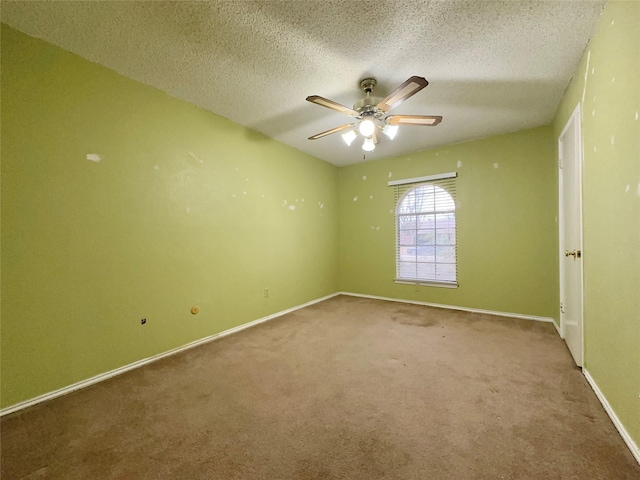 empty room with carpet floors, a textured ceiling, and ceiling fan