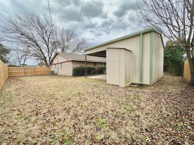 view of outdoor structure featuring a lawn