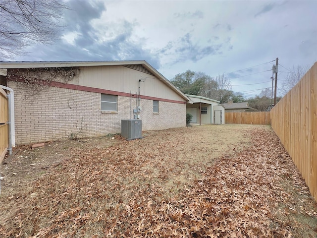 view of side of home featuring central AC unit