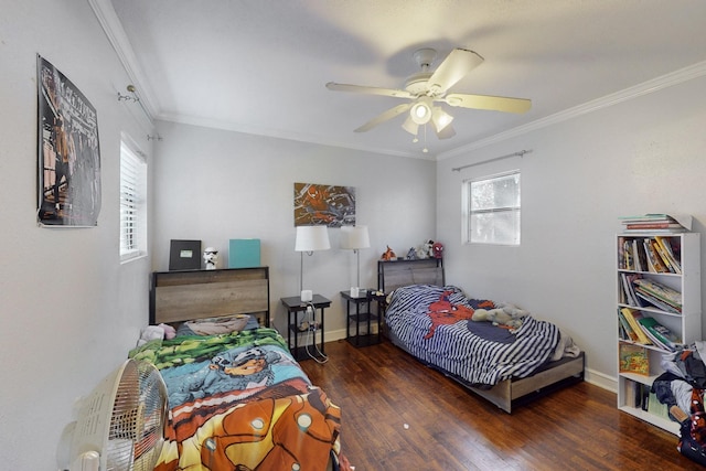 bedroom with dark hardwood / wood-style flooring, crown molding, and ceiling fan