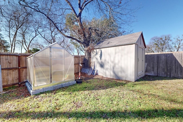 view of outbuilding featuring a lawn