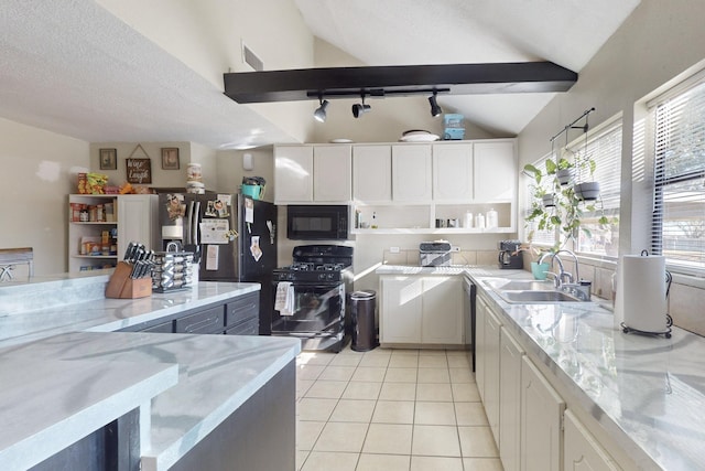 kitchen with sink, vaulted ceiling with beams, black appliances, and white cabinets