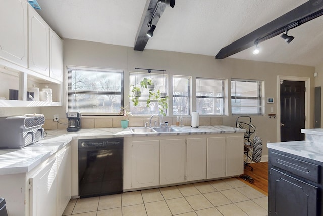 kitchen with white cabinets, beam ceiling, sink, and black dishwasher