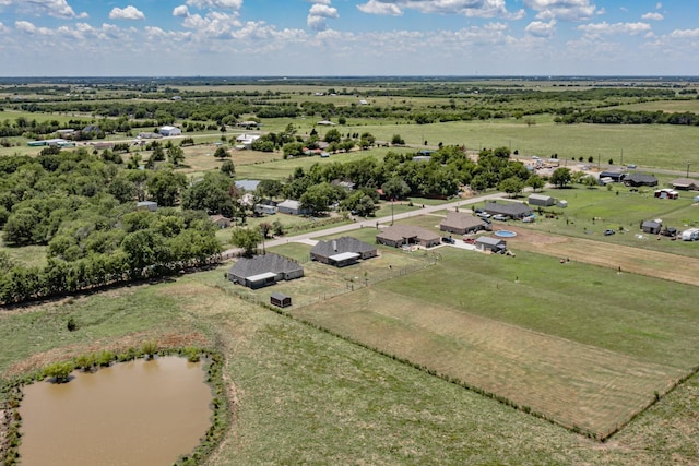 aerial view featuring a rural view and a water view