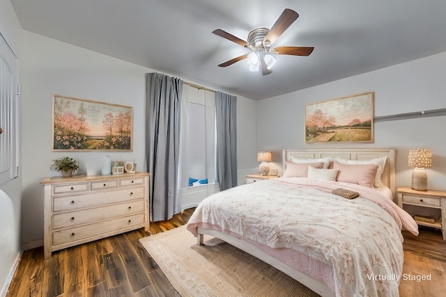 bedroom with ceiling fan and dark hardwood / wood-style floors