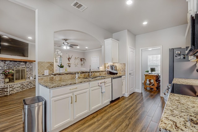 kitchen featuring ceiling fan, appliances with stainless steel finishes, dark hardwood / wood-style floors, light stone countertops, and white cabinets