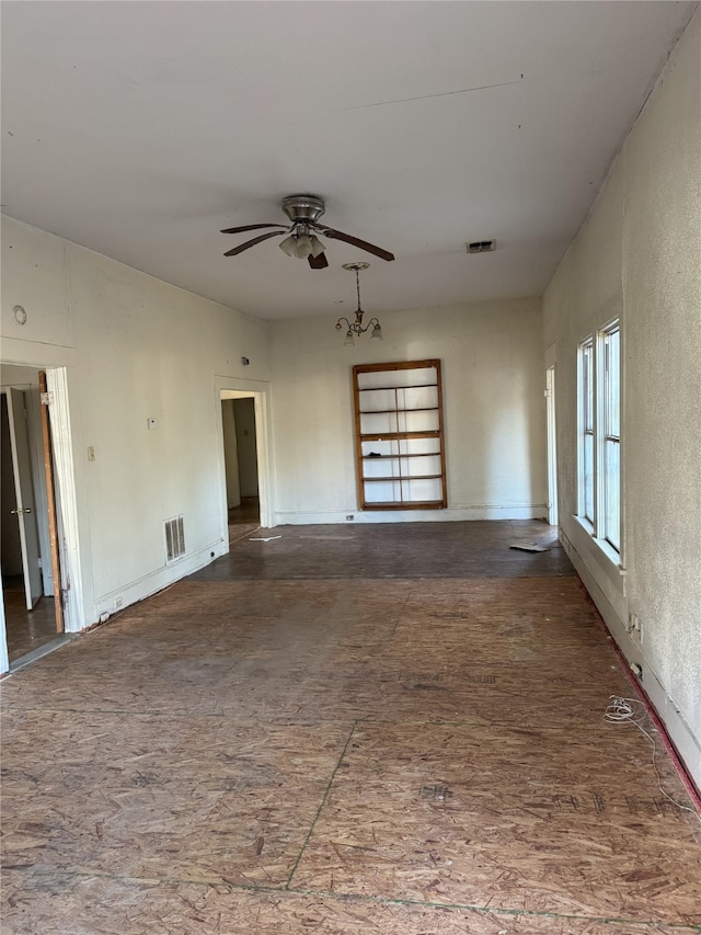 spare room with a ceiling fan and visible vents