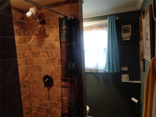 bathroom with crown molding and curtained shower