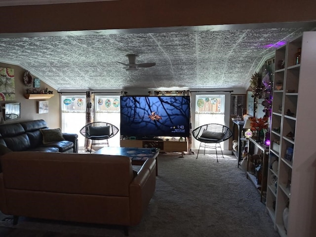 living room featuring ceiling fan and carpet