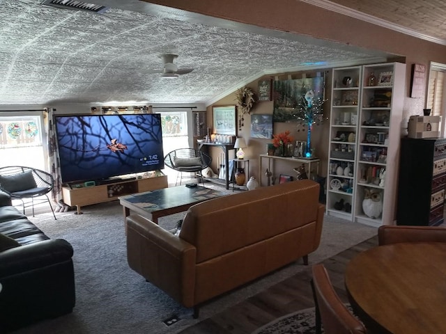 living room with ceiling fan, crown molding, and carpet floors