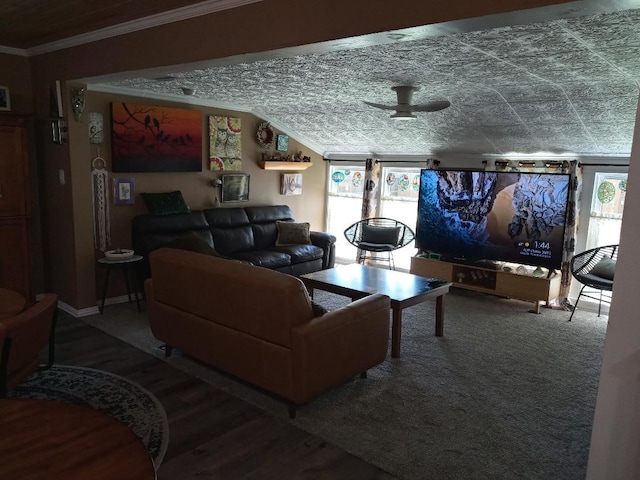 living room with ceiling fan and ornamental molding