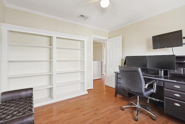 office area featuring hardwood / wood-style flooring, crown molding, ceiling fan, and a textured ceiling