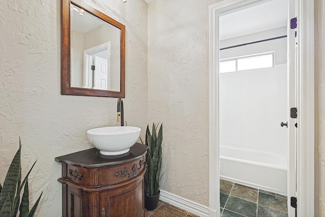 bathroom with vanity and shower / bathing tub combination