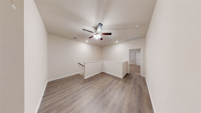 unfurnished room featuring ceiling fan and wood-type flooring