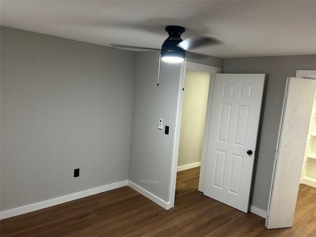 unfurnished room featuring ceiling fan and hardwood / wood-style floors