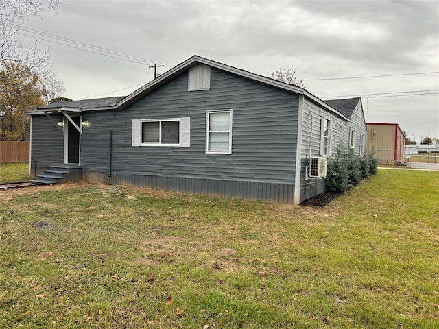 view of side of property featuring a yard