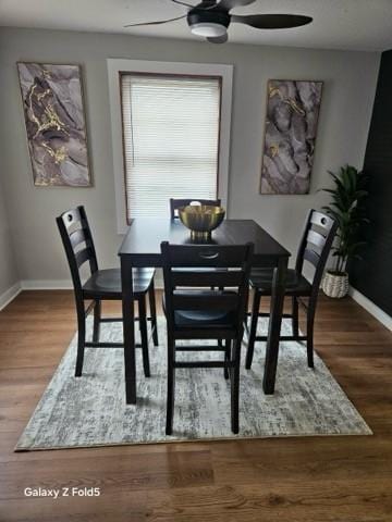 dining area with ceiling fan, wood finished floors, and baseboards