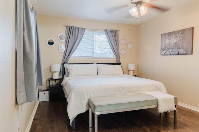 bedroom with dark wood-type flooring and ceiling fan