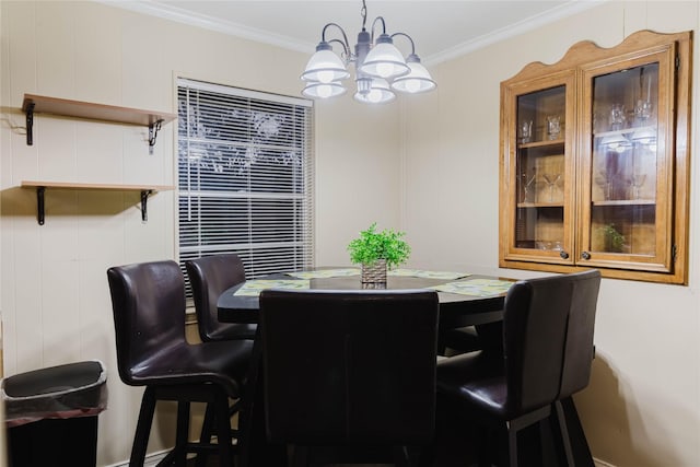 dining room featuring an inviting chandelier and crown molding