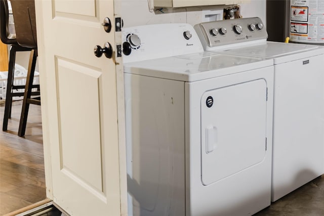 clothes washing area featuring washing machine and clothes dryer