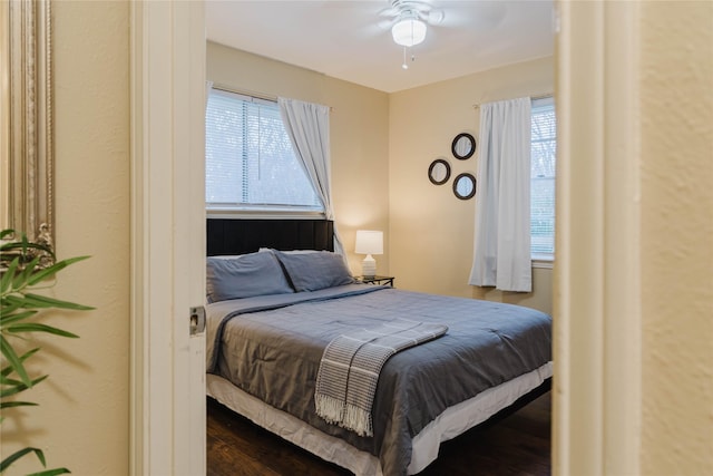 bedroom featuring ceiling fan and wood-type flooring