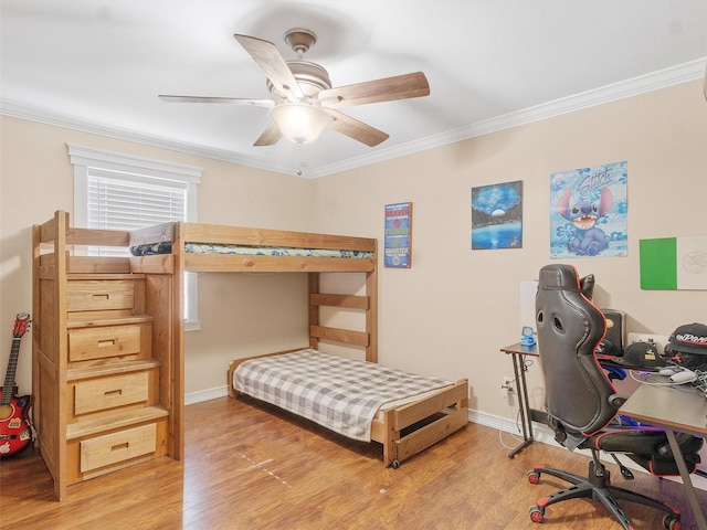 bedroom featuring ceiling fan, crown molding, and light hardwood / wood-style flooring