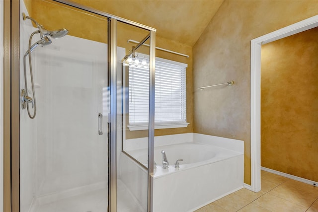 bathroom featuring tile patterned flooring and plus walk in shower