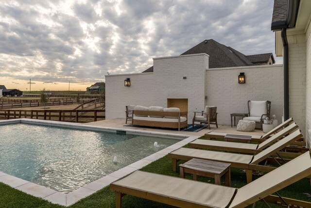 view of swimming pool featuring a fenced in pool and fence