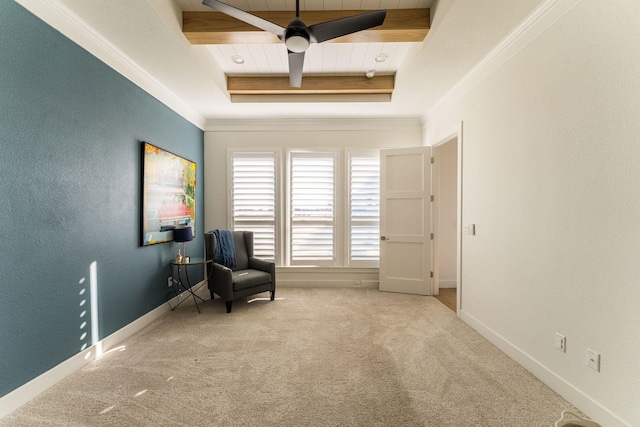 sitting room featuring a tray ceiling, carpet, wood ceiling, and ceiling fan