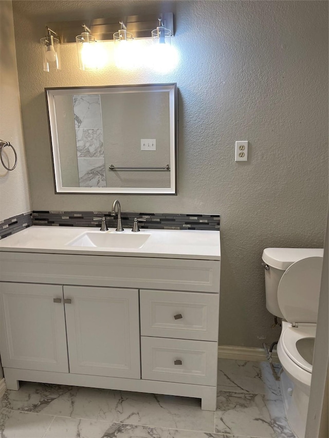 bathroom with vanity and a tile shower