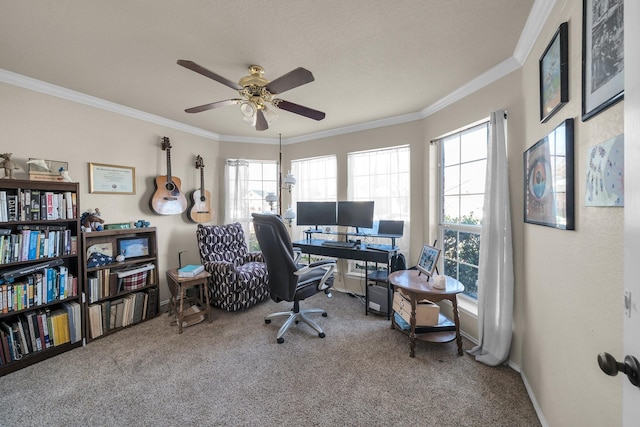 carpeted office space featuring ceiling fan and crown molding