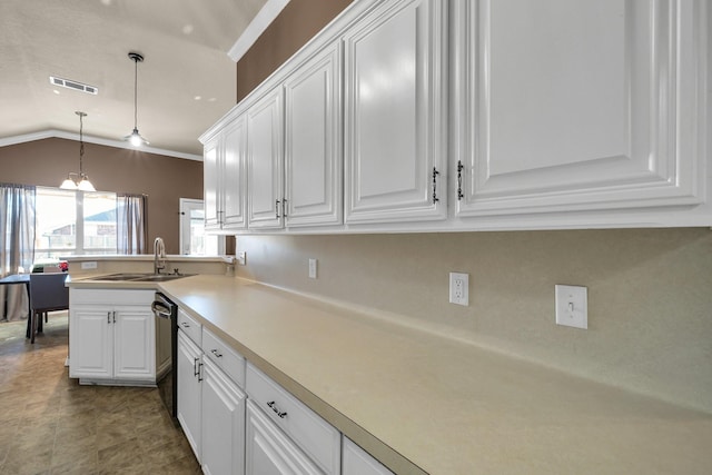 kitchen featuring a notable chandelier, hanging light fixtures, stainless steel dishwasher, white cabinets, and sink