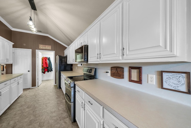 kitchen with appliances with stainless steel finishes, hanging light fixtures, vaulted ceiling, crown molding, and white cabinets