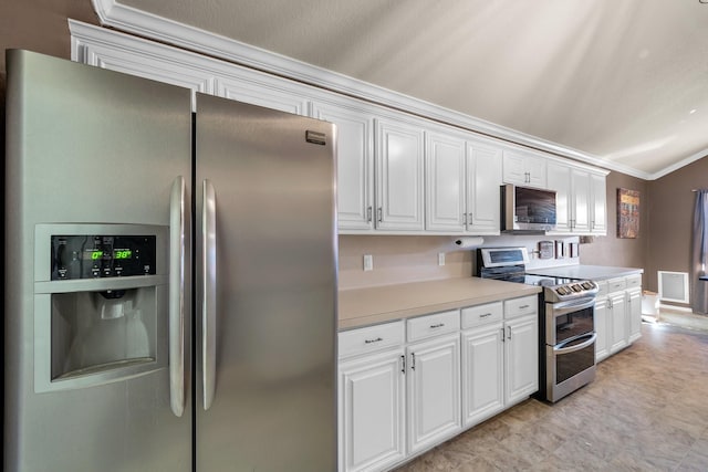 kitchen with appliances with stainless steel finishes, crown molding, and white cabinetry